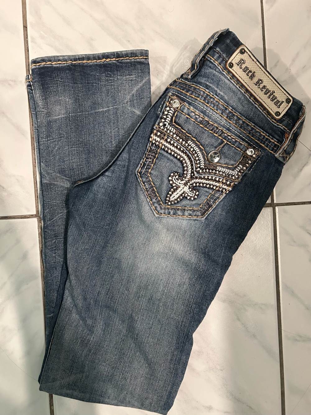 Rock Revival Women's Distressed Blue Bootcut Jeans with Silver Embellishment